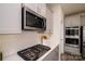 Stainless steel appliances and gas cooktop in a modern kitchen setting at 6420 Barcelona Way, Charlotte, NC 28214