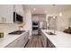 Modern kitchen with white quartz countertops and stainless steel appliances at 6420 Barcelona Way, Charlotte, NC 28214