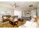 Spacious living room with hardwood floors and a ceiling fan at 6420 Barcelona Way, Charlotte, NC 28214