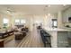Open concept living area with hardwood floors and a modern kitchen at 6420 Barcelona Way, Charlotte, NC 28214