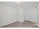 Cozy bedroom with neutral decor and carpet at 815 Sherwood Ave, Albemarle, NC 28001