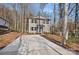 Two story house with a driveway and a wooded area at 815 Sherwood Ave, Albemarle, NC 28001