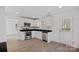 Modern kitchen with white cabinets, stainless steel appliances, and black countertops at 815 Sherwood Ave, Albemarle, NC 28001