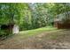 Large backyard with shed and lush greenery at 825 W Ketchie St, China Grove, NC 28023