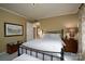 Bedroom with a wooden frame bed and view of another room at 825 W Ketchie St, China Grove, NC 28023