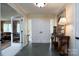 Bright entryway with slate tile floor, double doors, and a console table at 825 W Ketchie St, China Grove, NC 28023