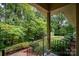 Front porch with wooded view, offering a tranquil setting at 825 W Ketchie St, China Grove, NC 28023