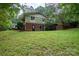Brick and siding home nestled on a lush, grassy lot at 825 W Ketchie St, China Grove, NC 28023