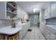 Bright kitchen with white cabinets and tile flooring at 825 W Ketchie St, China Grove, NC 28023