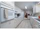 Kitchen with white appliances and view into dining area at 825 W Ketchie St, China Grove, NC 28023