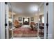 Mirrored doors reveal a view of the living room's luxurious furnishings at 825 W Ketchie St, China Grove, NC 28023