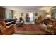 Elegant living room features a plush leather sofa and ornate area rug at 825 W Ketchie St, China Grove, NC 28023