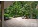 Spacious patio with wooded backdrop, perfect for outdoor entertaining at 825 W Ketchie St, China Grove, NC 28023