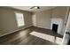 Bedroom with hardwood floors, ceiling fan and fireplace at 832 Richard Ave, Kannapolis, NC 28081