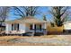 Charming white house with gray accents, a covered porch, and a fenced yard at 832 Richard Ave, Kannapolis, NC 28081