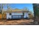 Rear view of house, showing white siding and small deck at 832 Richard Ave, Kannapolis, NC 28081