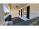 Inviting front porch with gray railings and black shutters at 832 Richard Ave, Kannapolis, NC 28081