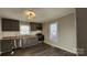 Modern kitchen with gray cabinets, granite countertops, and stainless steel appliances at 832 Richard Ave, Kannapolis, NC 28081