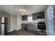 Modern kitchen with gray cabinets, granite countertops and stainless steel appliances at 832 Richard Ave, Kannapolis, NC 28081