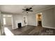 Living room features hardwood floors, fireplace and bathroom access at 832 Richard Ave, Kannapolis, NC 28081