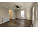 Bright living room with hardwood floors and ceiling fan at 832 Richard Ave, Kannapolis, NC 28081