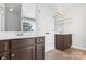 Double vanity bathroom with dark brown cabinets at 9113 Rowe Ct, Charlotte, NC 28278