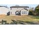 Two-story house exterior with backyard and grass at 9113 Rowe Ct, Charlotte, NC 28278