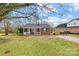 Brick ranch home with front porch and driveway at 916 Church St, Kings Mountain, NC 28086