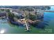 Aerial view of lakefront property with private dock and pool at 921 Northeast Dr, Davidson, NC 28036