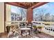 Private balcony with brick walls and wicker furniture at 921 Northeast Dr, Davidson, NC 28036