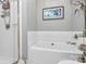 Bathroom with a large soaking tub, shower, and picture frame at 921 Northeast Dr, Davidson, NC 28036