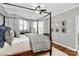 Main bedroom with a four-poster bed and plenty of natural light at 921 Northeast Dr, Davidson, NC 28036