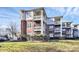 Brick building with multiple balconies and lush landscaping at 921 Northeast Dr, Davidson, NC 28036