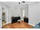 Home office with hardwood floors, ample light, and built-in storage at 921 Northeast Dr, Davidson, NC 28036