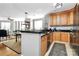 Modern kitchen with light wood cabinets and granite countertops at 921 Northeast Dr, Davidson, NC 28036