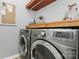 Laundry room with LG washer and dryer, and additional shelving at 921 Northeast Dr, Davidson, NC 28036