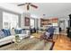 Open concept living room and kitchen with hardwood floors and stylish furniture at 921 Northeast Dr, Davidson, NC 28036