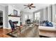 Living room with fireplace, hardwood floors, and large windows offering natural light at 921 Northeast Dr, Davidson, NC 28036