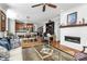 Open concept living room, kitchen, and fireplace, creating a warm atmosphere at 921 Northeast Dr, Davidson, NC 28036
