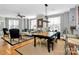 Spacious living room features hardwood floors, a ceiling fan, and ample natural light at 921 Northeast Dr, Davidson, NC 28036