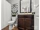 Clean bathroom with dark brown vanity at 9408 Hamel St, Charlotte, NC 28215