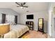 Spacious bedroom with vaulted ceiling, yellow and grey decor, and large bed at 9408 Hamel St, Charlotte, NC 28215