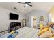 Spacious bedroom with vaulted ceiling, yellow and grey decor, and large bed at 9408 Hamel St, Charlotte, NC 28215