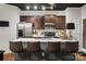 Modern kitchen with stainless steel appliances and breakfast bar at 9408 Hamel St, Charlotte, NC 28215
