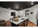 Modern kitchen with white quartz island, dark cabinetry and stainless steel appliances at 9408 Hamel St, Charlotte, NC 28215