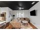 Living room with sectional sofa, coffee table, and large TV at 9408 Hamel St, Charlotte, NC 28215