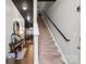 Modern staircase with dark wood railing leading to the upper level at 9408 Hamel St, Charlotte, NC 28215