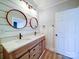 Elegant bathroom with double vanity, marble countertop and large mirrors at 1005 Venus St, Kannapolis, NC 28083