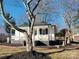 White house with front porch and landscaped yard at 1005 Venus St, Kannapolis, NC 28083