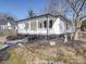 White house with a walkway and landscaped yard at 1005 Venus St, Kannapolis, NC 28083